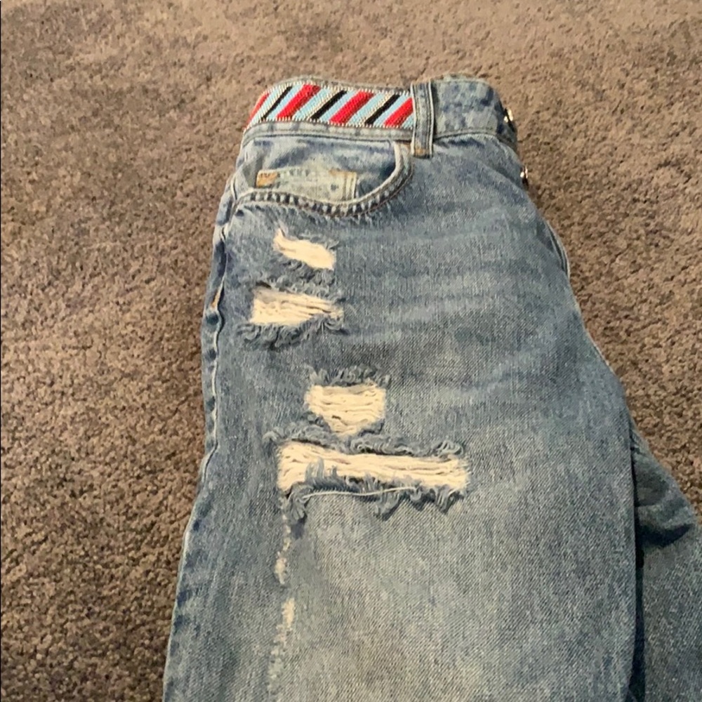 Woman’s distressed jeans
